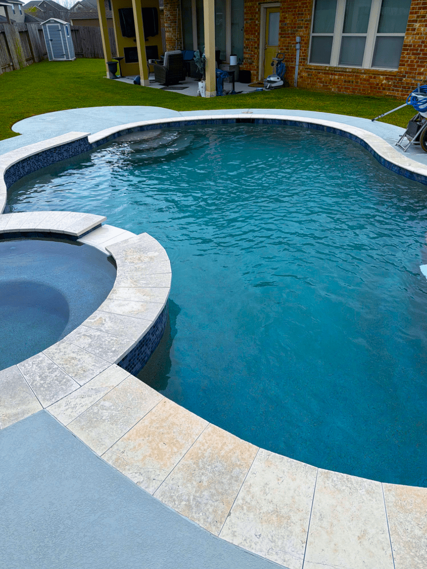 Backyard pool and raised spa from the existing Penny’s Pool Service gallery